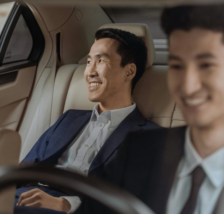 Car with Driver Islamabad – passenger enjoying safe and comfortable ride